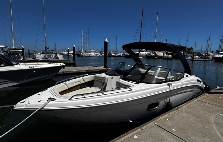 a boat docked at a dock with a boat in the water