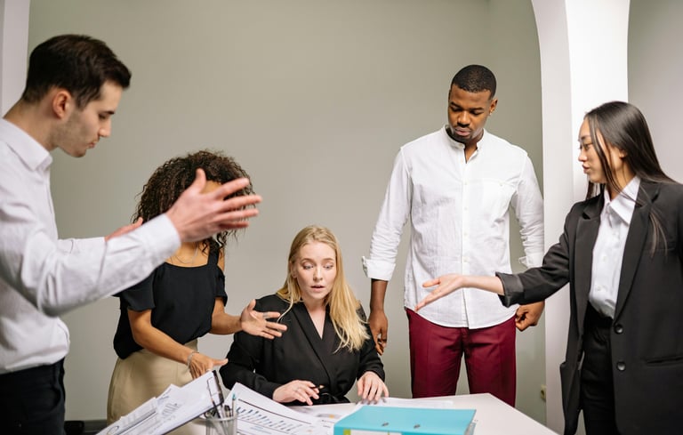 A high performing team member surrounded by colleagues who need their help on the verge of a burnout