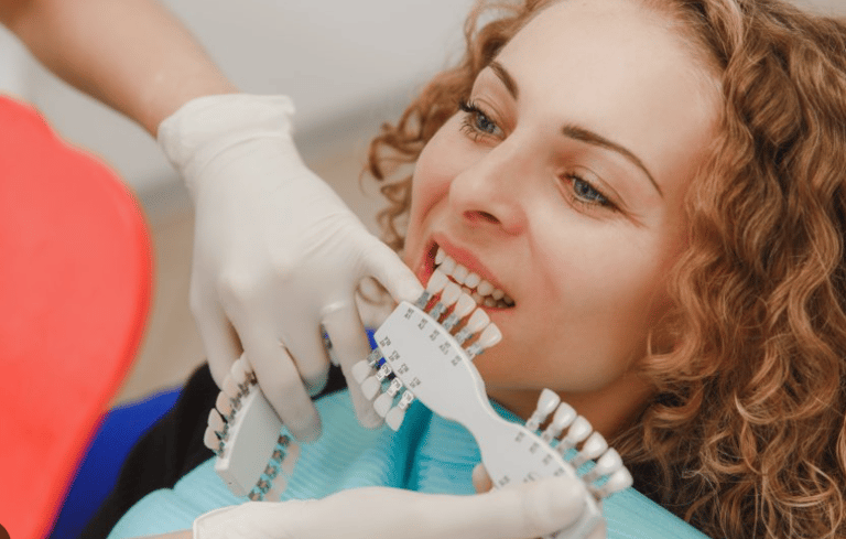 A women getting the whiteness of her teeth measured.