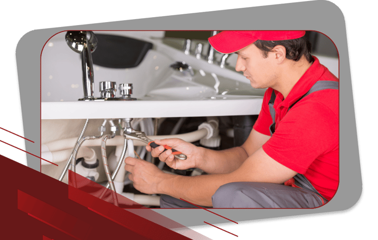a plumber in a red shirt and a red hat