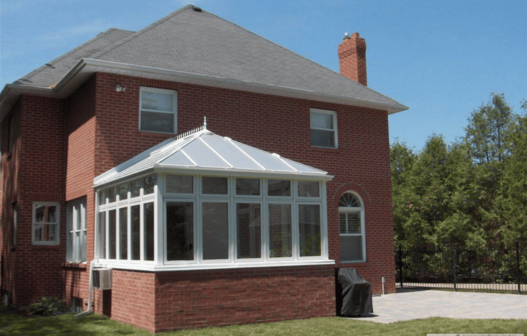 Conservatory with 4 season glass panels and polycarbonate roof.