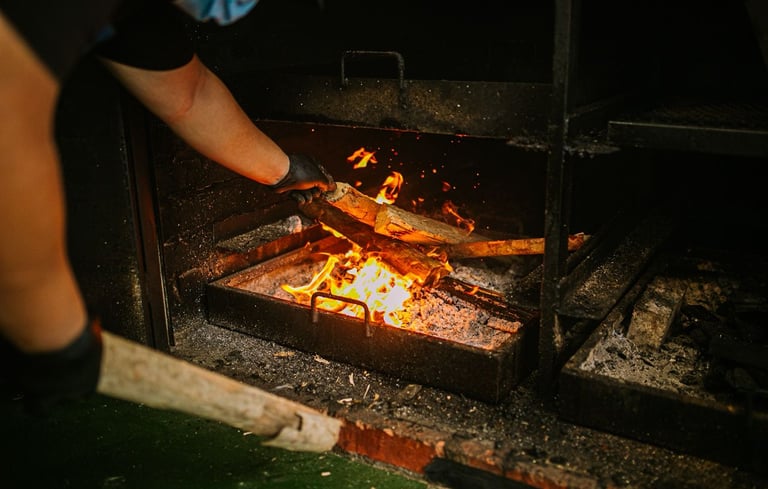 a person is cooking food on a grill