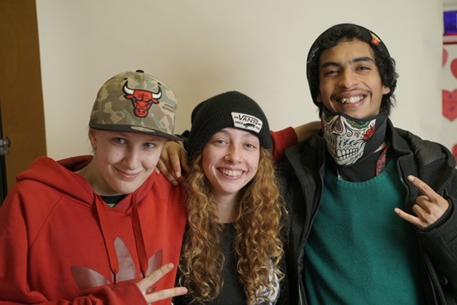 a group of young people standing next to each other at restoring hope ministries