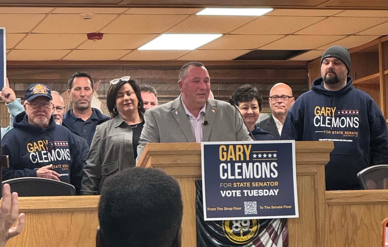 a group of people standing around a podium with signs