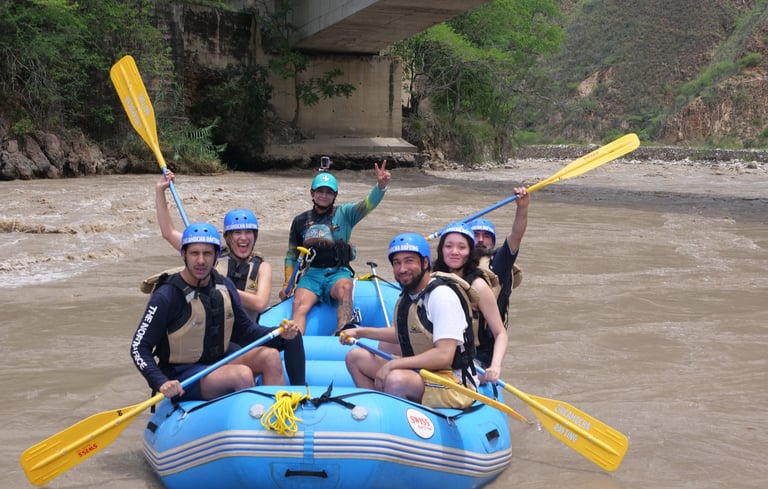 a group of people on raft raft raft rafting down in the fonce river in san gil, colombia.