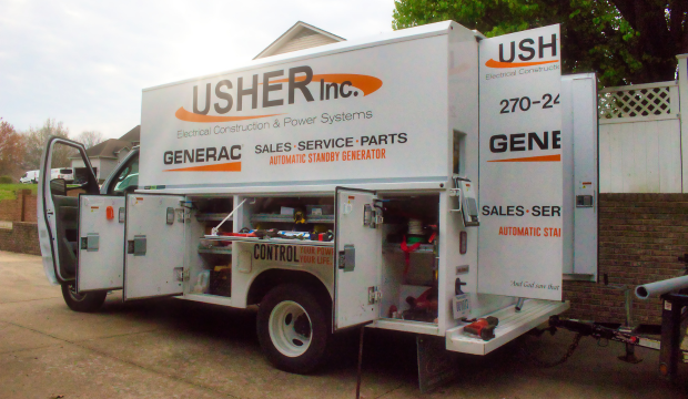 A Usher Inc service truck sitting in front of a house