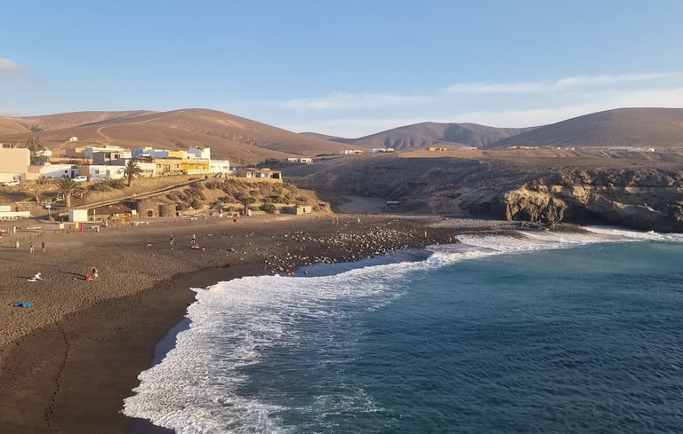 a beach with a view of a beach and a blue sky