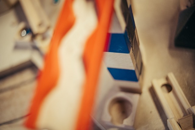 Close-up of a colorful wooden systems thinking installation