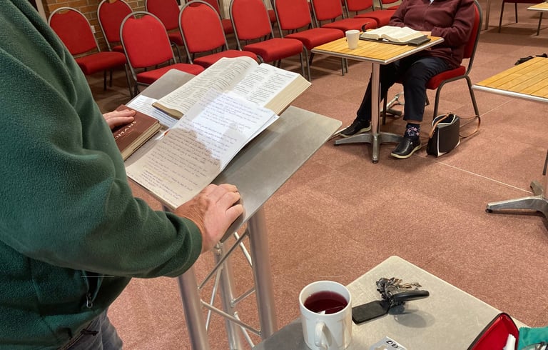 Gary Brown standing at preaching lectern
