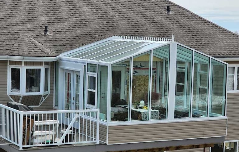 Gable Solarium with 4 season glass panels, roof crests and French door.
