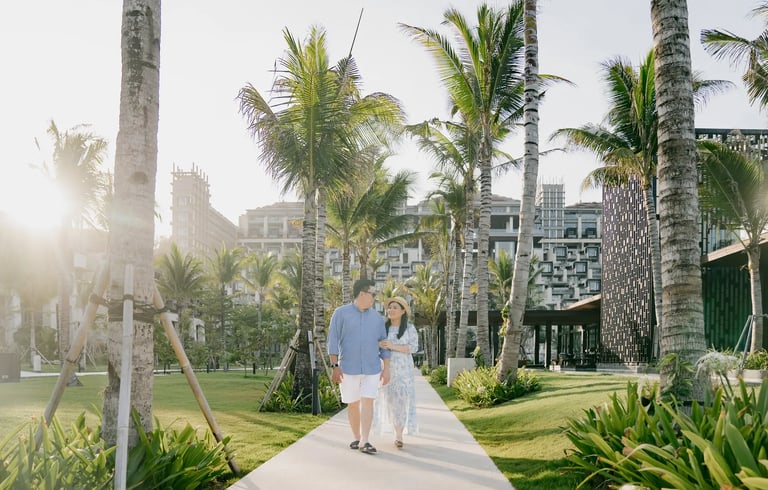 Couple photography session surrounded by tropical gardens at The Apurva Kempinski Bali in Nusa Dua