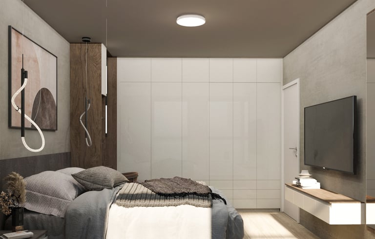 A contemporary bedroom featuring a bed, a television, and a desk, showcasing a stylish,functional