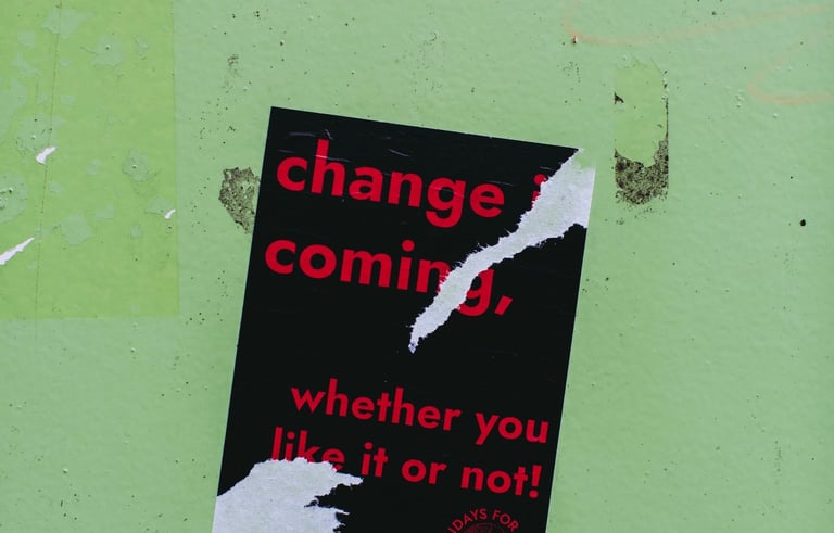 a sign on a wall with a sign that says change
