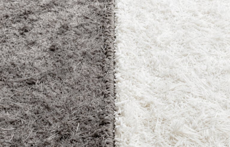 A split-screen comparison of a carpet before and after deep cleaning. One side is a dull, dirty grey, while the other side is a bright, pristine white, showcasing powerful restoration.
