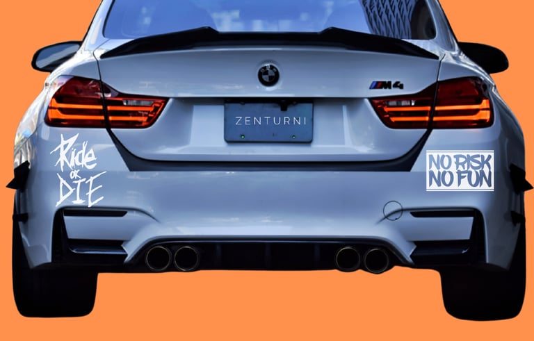 Rear view of a white BMW M4 sports car with custom stickers on an orange background.