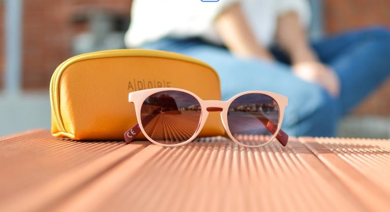a pair of sunglasses and a yellow case