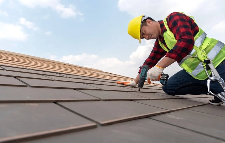 a roof worker is using a drill to fix the roof