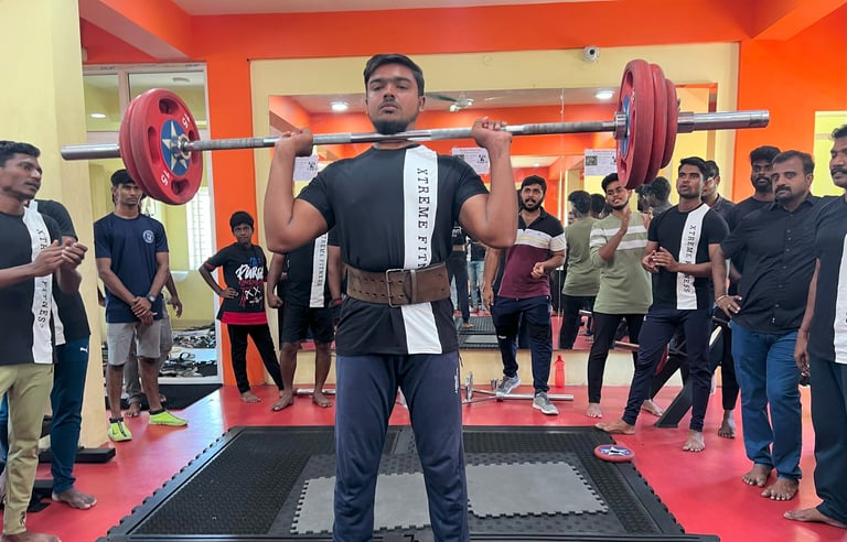 man lifting weight in gym.