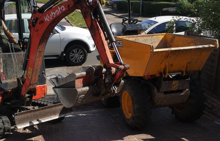 Dumper moving spoil on small construction site in the West Midlands