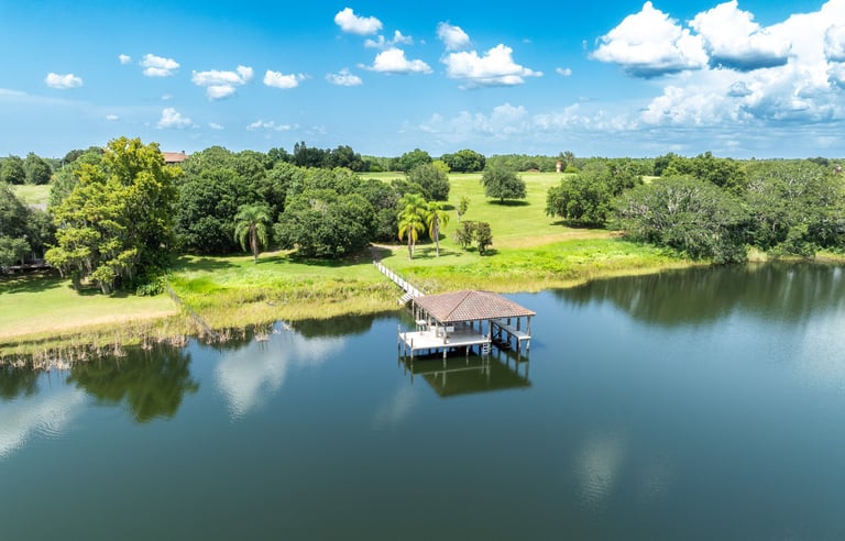 a boat dock with a small boat on the water