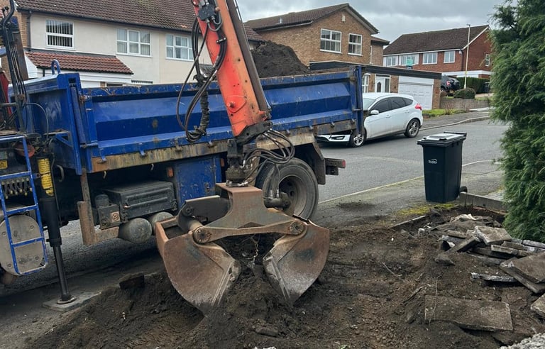 Grab lorry clearing soil from residential site in Birmingham