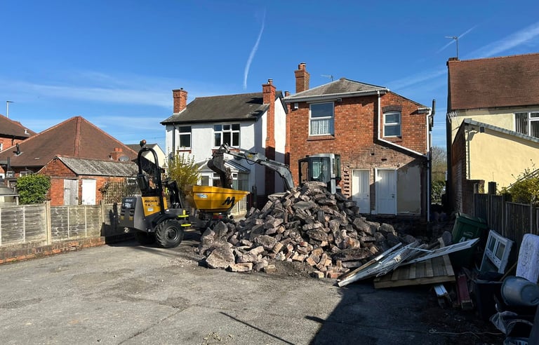 Hydraulic breaker removing concrete in Birmingham