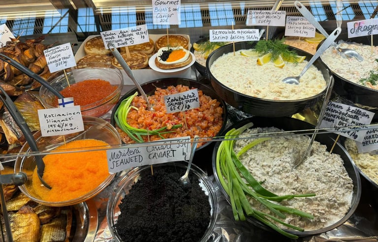 a variety of different types of food in a display case