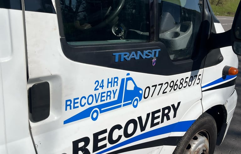 alt="Vehicle being recovered at night in Malvern"