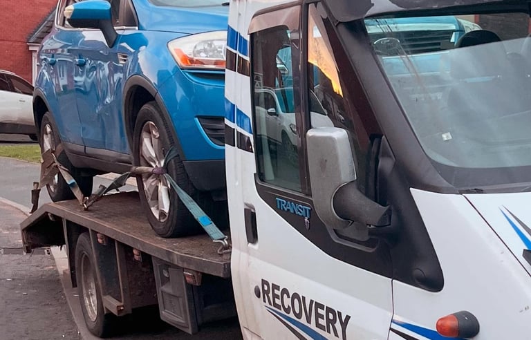 alt="Scrap car being collected from Worcester driveway"