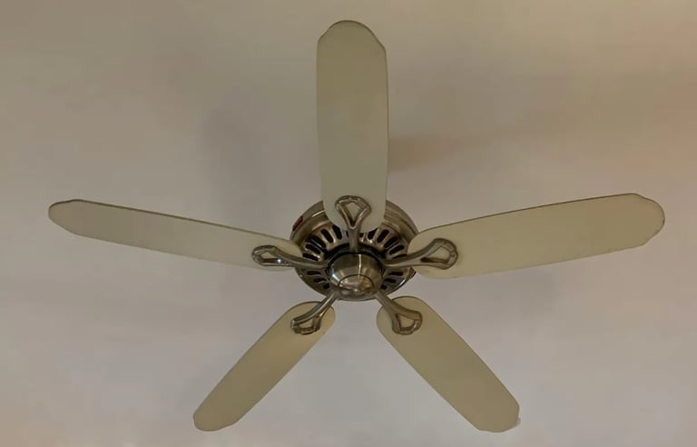 a ceiling fan with a white ceiling fan