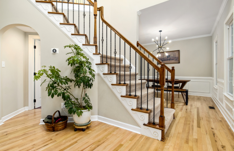 Staircase remodel with modern railing by Uprise Renovation in Charlotte home