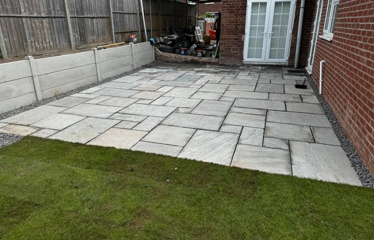 Patio slabbing installation in a Worcester garden by B R Building and Landscapes