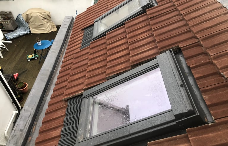 Roof window installed on tiled roof during loft conversion in Brighton and Hove.