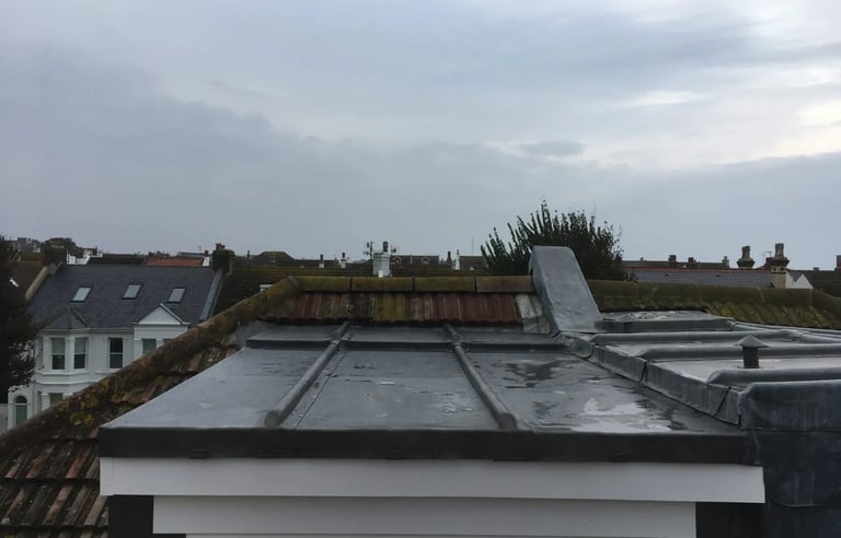 Flat loft conversion with window added to roof of Brighton home.