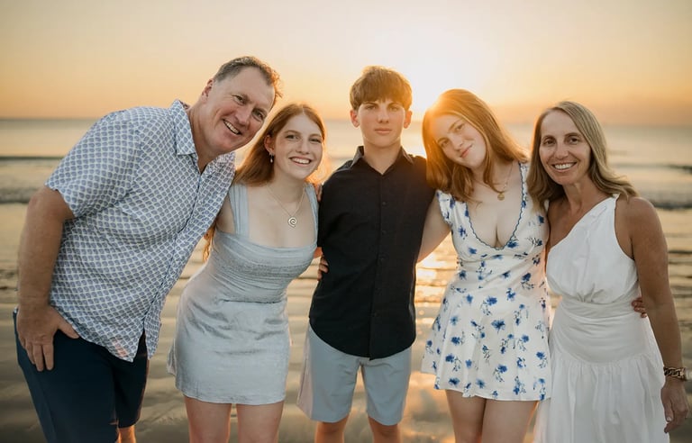 Natural family portrait captured during golden hour at Jimbaran Beach Bali