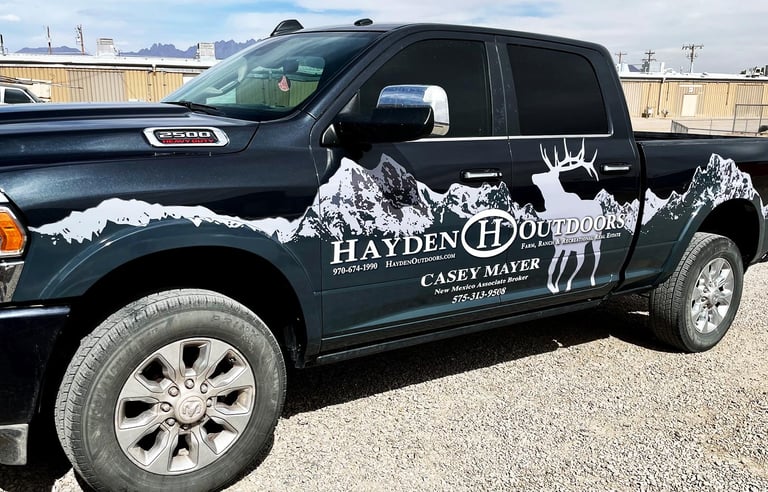 Partial truck wrap with a custom design of mountains for a local broker in Las Cruces, NM
