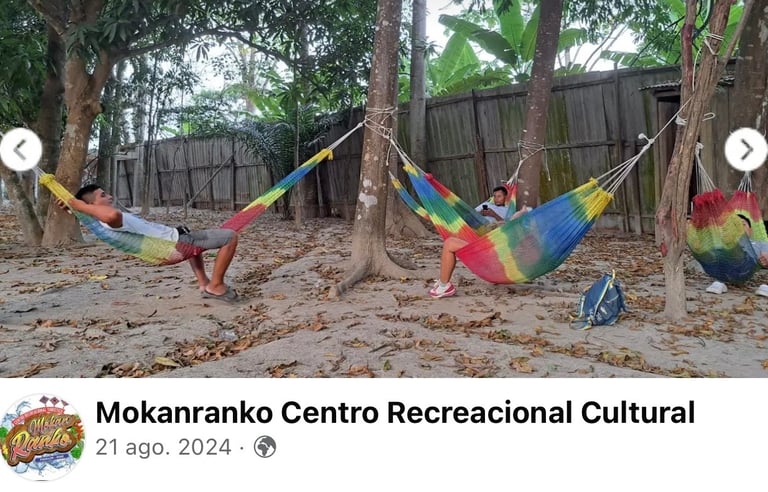 Guests relaxing in colorful woven hammocks tied to trees at Mokanranko Centro Recreacional Cultural.
