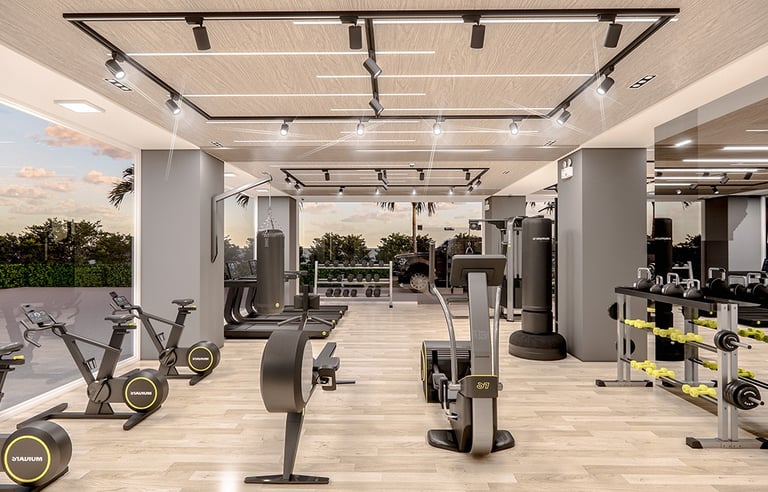 Modern fitness center and gym with cardio machines at Aperito Tower