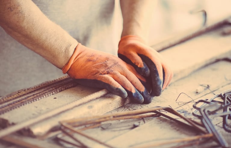 iron work for handy man with orange gloves on