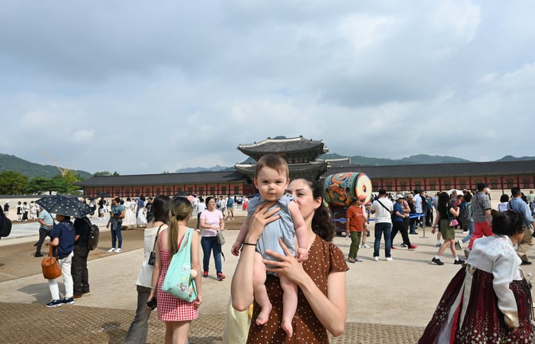 a woman holding a baby