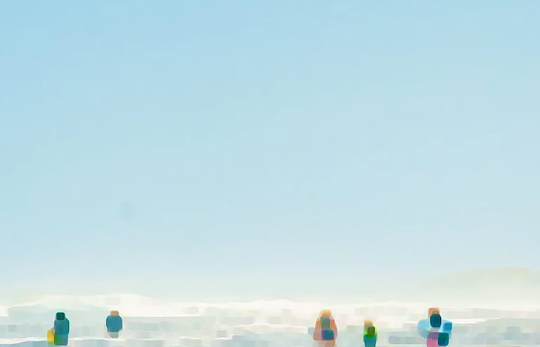 a group of people standing on a beach