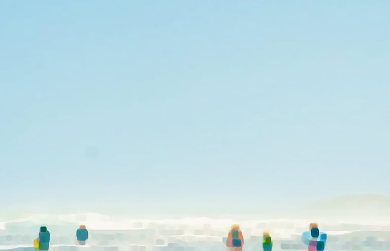 a group of people standing on a beach