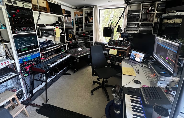 audio production suite with keyboard and synthesizers