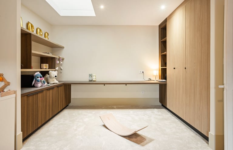 a room with a wooden floor and a wooden desk