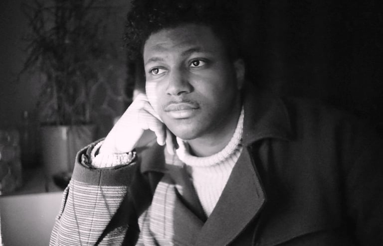 ryan morgan - man looking out a window in black and white