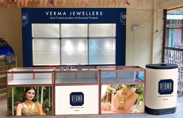 Jewellery exhibition stall featuring luxury gold jewelry displays and elegant brand signage.