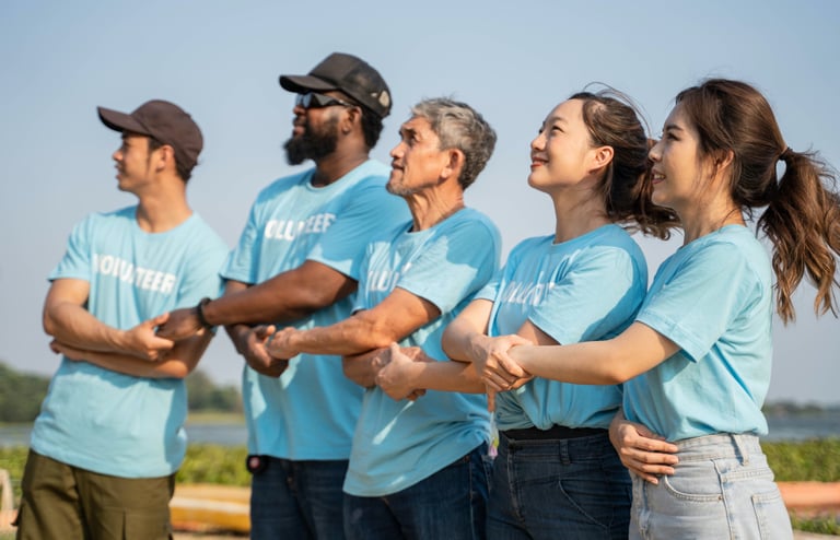 a nonprofit group of people standing in a line holding hands