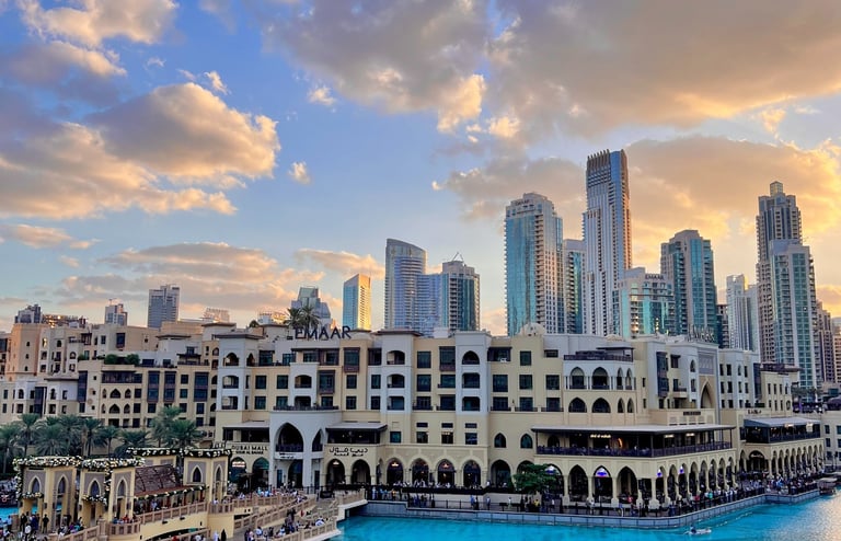 a cityscape of a river with a city in the background