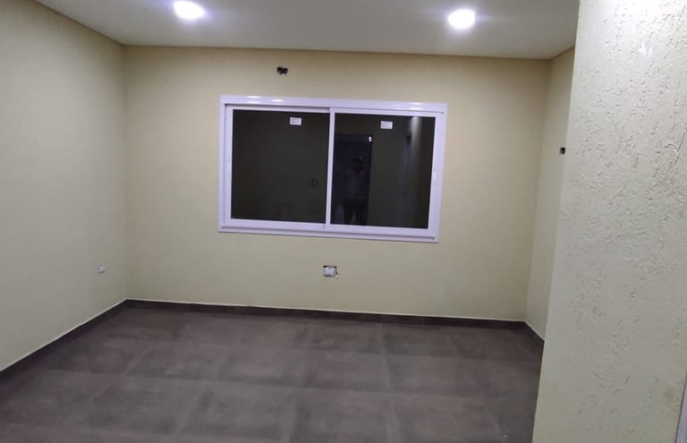 Casa con revestimiento texturado a llana RULATO