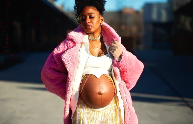 pregnant woman during maternity photo session in DC showing beautiful stomach